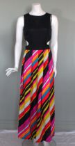 A 1970s cruise wear dress, of striped fabric with black jersey top with cut out at side front and