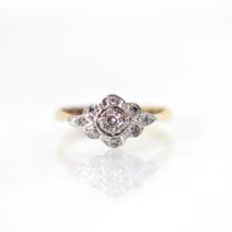 An Edwardian style diamond ring, the lozenge shaped head with central round cut diamond with