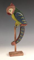 A folk art nodding parrot on stand, 20th century, the naively painted double sided body with