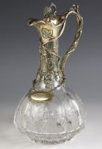A 20th century silver plated claret jug, the thumbpiece designed as a bunch of grapes, leading to