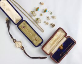 A selection of yellow metal and gold coloured items, including a rope twist chain, with applied ‘9c’