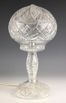 A Waterford style glass table lamp, 20th century, the cut glass dome shade leading to a cut glass