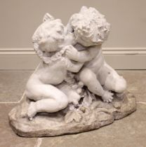 A Victorian reconstituted stone figural group, modelled as two embracing putti on a naturalistic