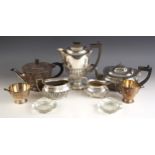 An Art Deco style silver plated tea service, comprising hot water jug, tea pot, sugar bowl and