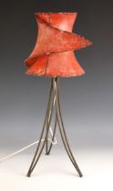 A mid 20th century vellum table lamp, the 'wrap-around' shade upon three iron hairpin type supports,