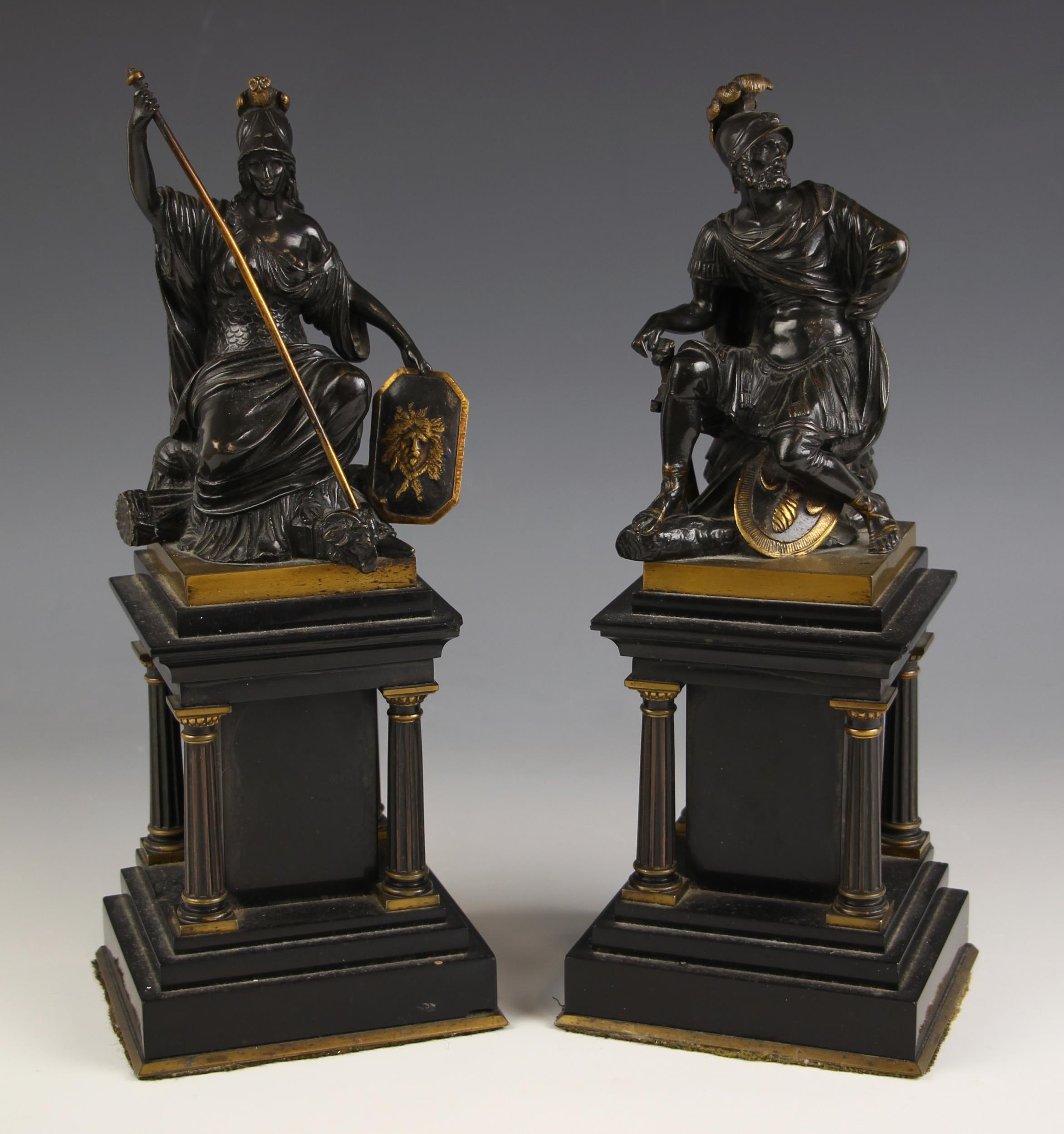 A pair of patinated bronze figures, 19th century, the seated figures modelled as Mars and Minerva,