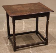 An 18th century oak side table, the moulded three plank top over a frieze drawer to the side, upon