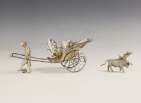 A silver plated cruet set, modelled as a man and cart, with triple cruet set, 23cm long, with a