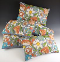 Six modern crewel work cushions, each extensively patterned to the front with flowers and foliage,