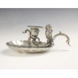 A silver plated novelty chamberstick, the scroll handle with owl shaped vesta with hinged head,