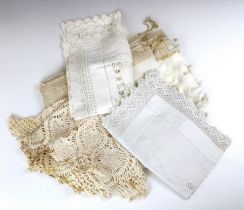 A quantity of linen, crochet trimmed tablecloth/bedspread, an embroidered cotton tablecloth, a nylon