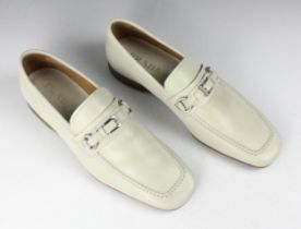 A pair of Prada men's loafers, with buckle detail, in cream leather, maker's mark to interior, UK