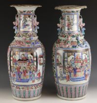 A pair of Chinese porcelain famille rose vases, Canton, 19th century, each of large baluster form