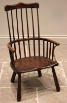 A primitive Welsh ash, elm and beech comb back chair, early 19th century, the stick back and