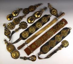 A collection of horse brasses, 19th century and later, the majority to leather martingales, to