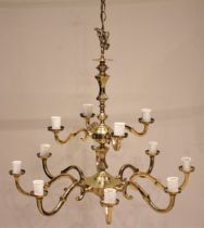 A gilt brass chandelier, 20th century, formed with a central column and two graduated tiers of 'S'