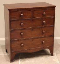 An early 19th century mahogany chest of drawers, formed with two short and three long graduated