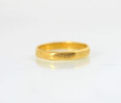 A 22ct yellow gold wedding band, of octagonal form, stamped ‘S&W’ London, indistinct date letter,