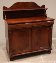 A Victorian mahogany chiffonier, the raised back with scroll terminals and a single shelf upon 'S'