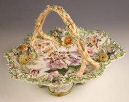 An English porcelain basket, circa 1840, the well decorated with a floral spray, surrounded by
