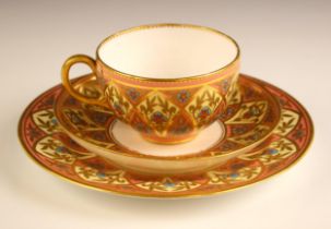 A Royal Crown Derby porcelain trio, circa 1884, each piece featuring Tudor roses surrounded by