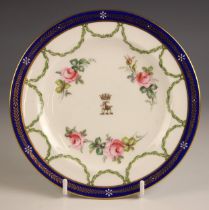 A Royal Crown Derby side plate, commissioned for The 11th Duke of Bedford, bearing crest with