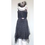 A mid 1920s black lace evening dress, lined with crepe de shine, with handkerchief hem, with