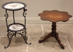 A 19th century oak tripod table, the scalloped circular top upon a baluster column and three