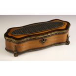 A French walnut and rosewood serpentine jewellery casket, mid-19th century, the hinged cover applied