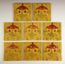 Eight Art Nouveau tiles, late 19th/early 20th century, each with a stylised floral and foliate