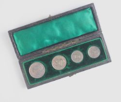 A cased set of Maundy money, Edward VII (1841-1910) the case enclosing fourpence, threepence, and