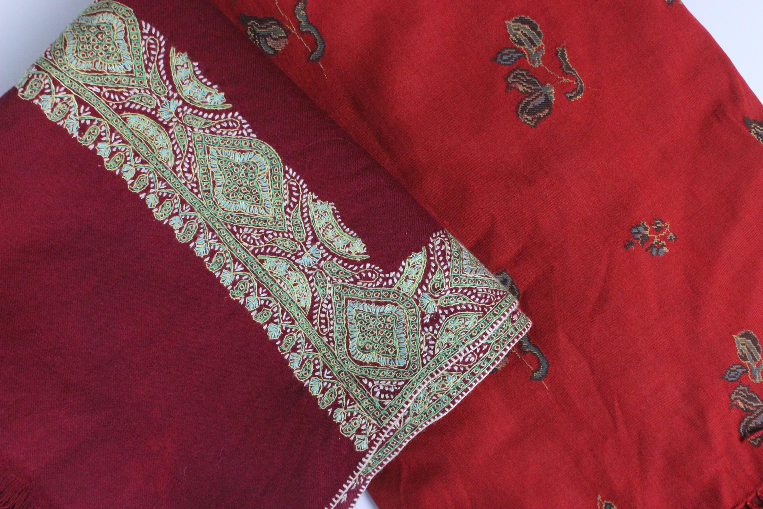 A mid Victorian crimson wool long shawl with embroidered borders of green and turquoise, with fringe - Image 2 of 2