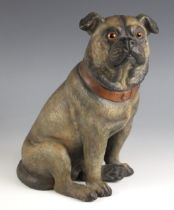 A cold painted pottery figure of a pug, late 19th/early 20th century, modelled seated, with orange