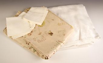 Two pairs of glazed cotton panel type curtains, early 20th century, each with floral sprays to a