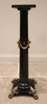 An Empire Movement ebonised hardwood pedestal, late 19th century, the tapering fluted column applied