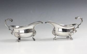 A pair of George V silver sauce boat, H Pidduck and Sons, London 1935, the flying handle above