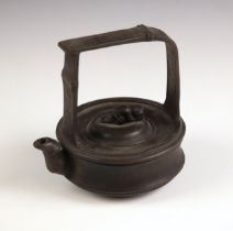 A Chinese Yixing pottery kettle and cover, 20th century, the circular reservoir with dome