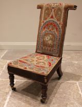 A Victorian mahogany prie dieu chair, in arcaded Gothic needlepoint fabric, the 'T' shaped back