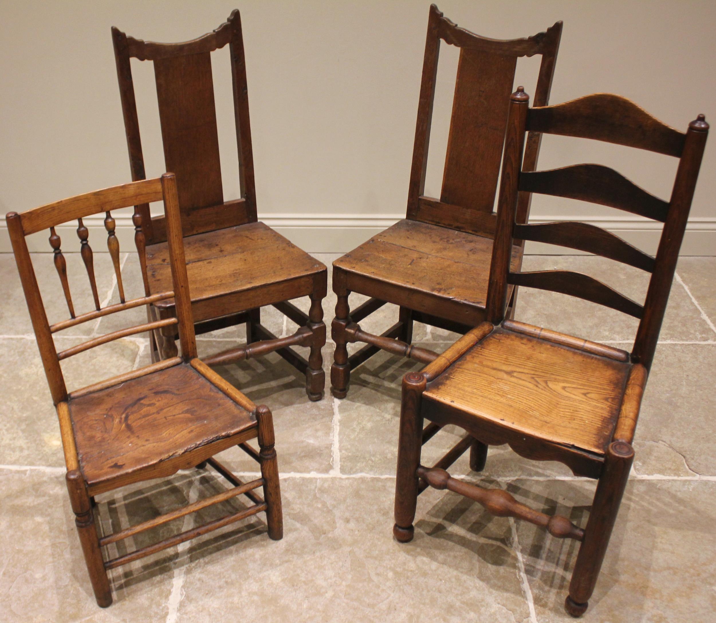 A pair of 18th century oak hall chairs, each with a splat back over a board seat upon baluster and - Image 2 of 2