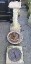 A reconstituted pedestal bird bath, the fluted column moulded in relief with mice and climbing