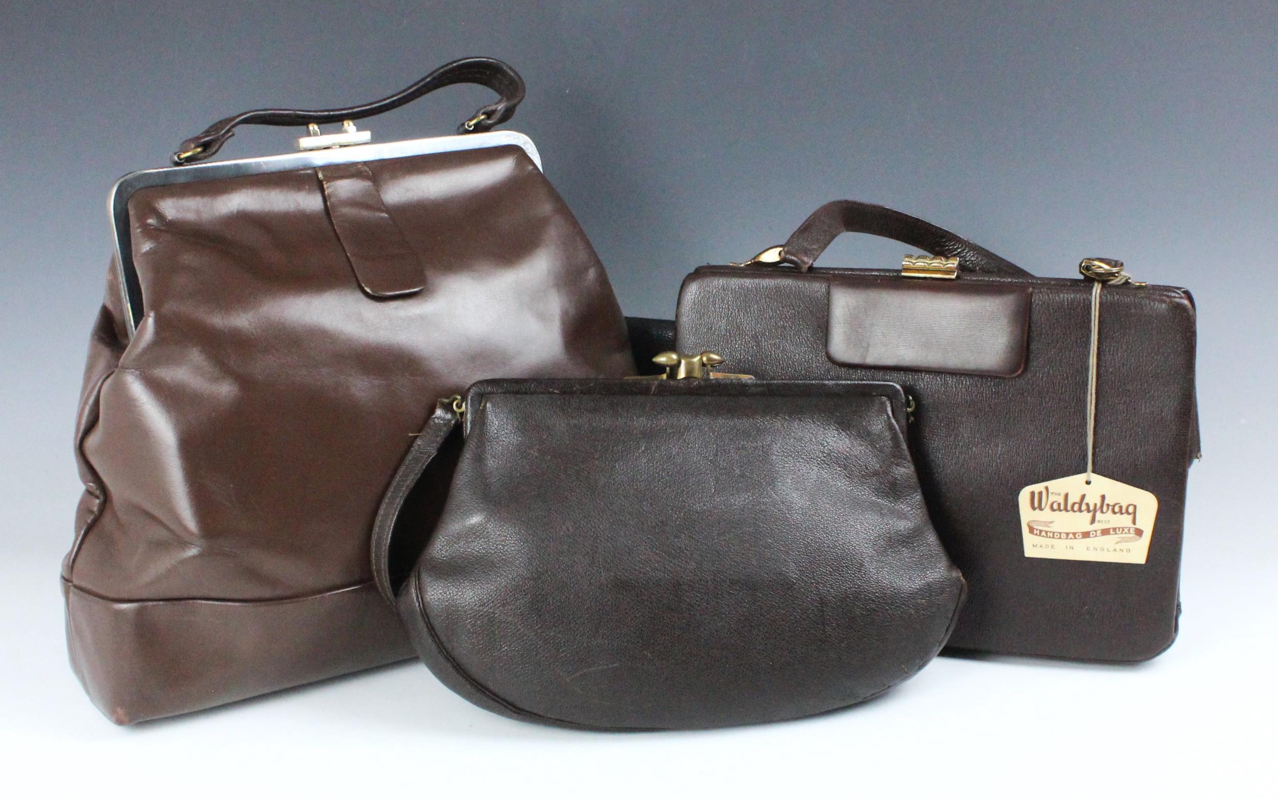 A brown leather handbag of tradition style, with original Waldybag label, together with three