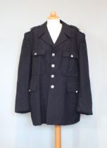 A navy blue wool ‘Cumbria Constabulary’ policeman’s tunic, with four others of various sizes (5)
