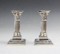 A pair of Edwardian silver candlesticks, Hawksworth, Eyre & Co Ltd, Sheffield 1904, the removeable