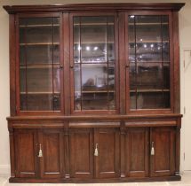 A Victorian mahogany glazed library bookcase, of country house proportions, the moulded cornice