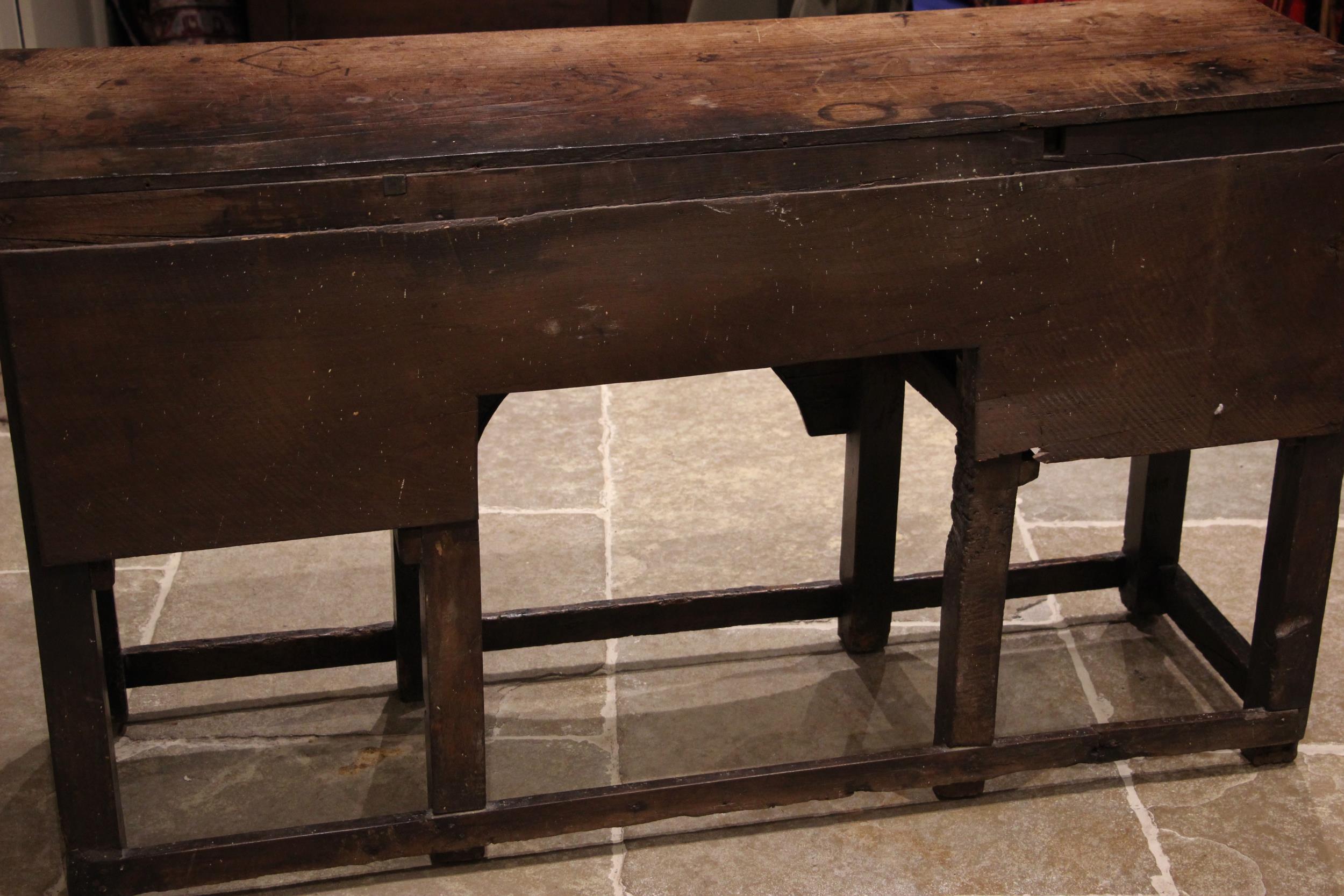 An 18th century oak dresser, the open plate rack with a moulded cornice and plain frieze over - Image 5 of 5