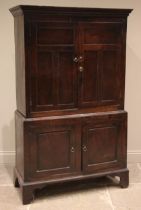 An 18th century oak livery/hall cupboard, of cottage proportions, probably Welsh, the moulded