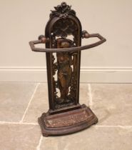 A Victorian cast iron Greek revival stick stand, the bow front rail upon an arched openwork