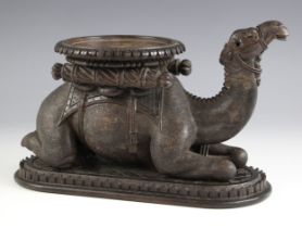 An Anglo-Indian carved hardwood model of a kneeling camel, possibly teak, late 19th century, natural