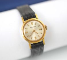 A ladies Jaegar LeCoultre wristwatch, the circular cream dial with baton markers, within a plain