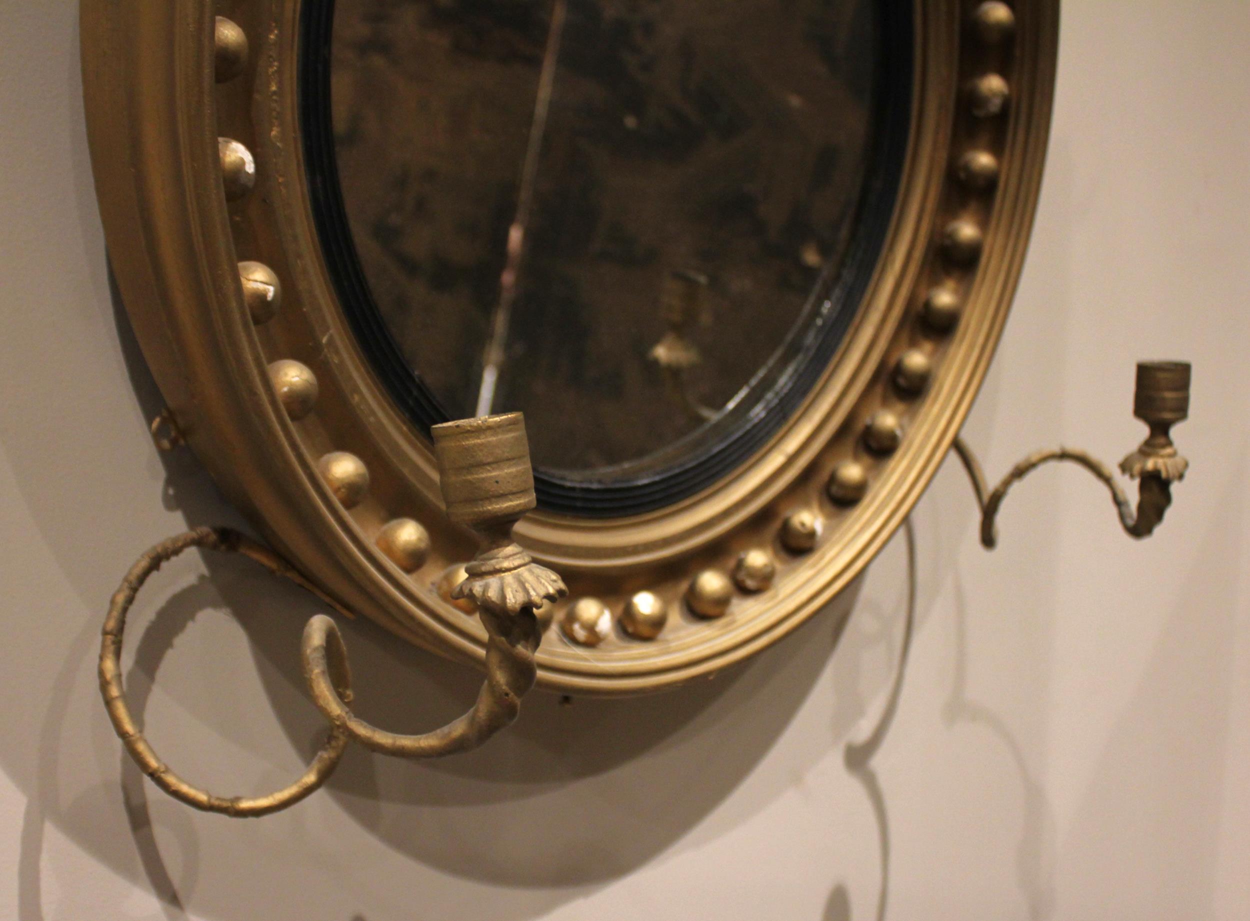 A Regency girandole wall mirror, with a leafy fruit crest over the moulded circular frame applied - Image 2 of 3